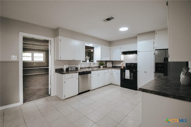 kitchen with electric range, visible vents, dark countertops, dishwasher, and a sink
