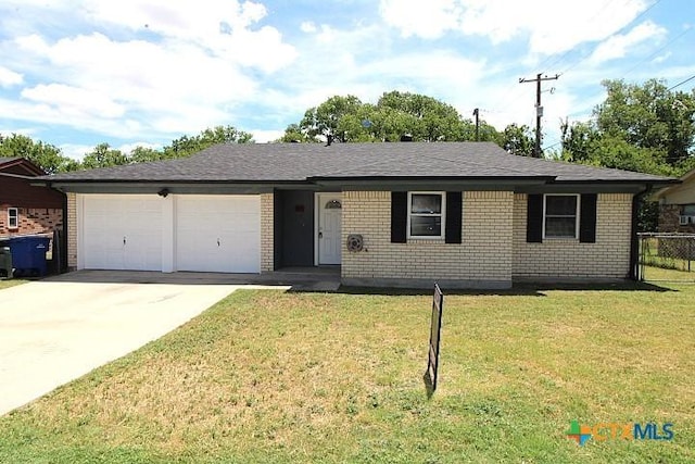 1306 Dryden Ave, Copperas Cove, TX 76522 - ranch-style house with an attached garage, driveway, and brick siding