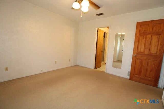 1306 Dryden Ave, Copperas Cove, TX 76522 - unfurnished bedroom with light carpet and a ceiling fan