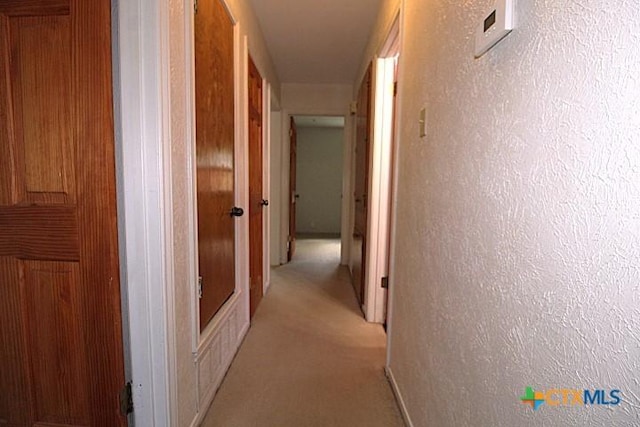 1306 Dryden Ave, Copperas Cove, TX 76522 - corridor with light colored carpet and baseboards