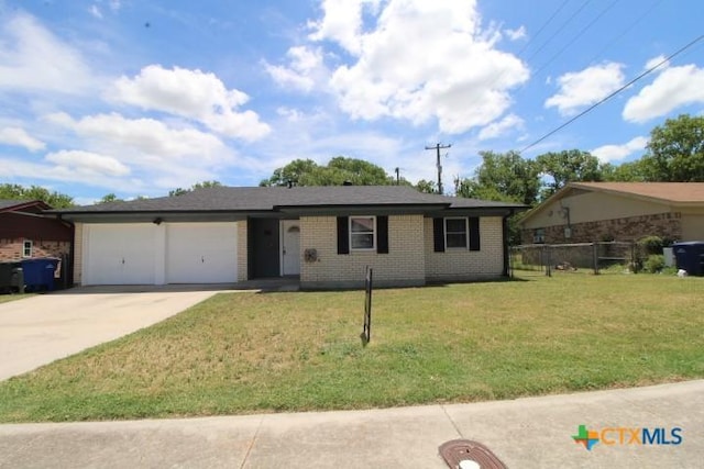 1306 Dryden Ave, Copperas Cove, TX 76522 - ranch-style house featuring driveway, a garage, and brick siding