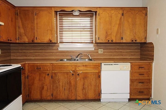1306 Dryden Ave, Copperas Cove, TX 76522 - kitchen featuring white appliances, decorative backsplash, light tile patterned floors, and brown cabinetry