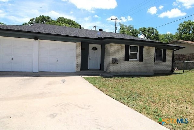 1306 Dryden Ave, Copperas Cove, TX 76522 - single story home with concrete driveway, an attached garage, and brick siding