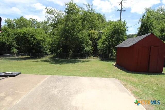 1306 Dryden Ave, Copperas Cove, TX 76522 - fenced backyard with a patio and a shed