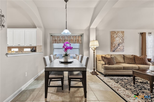 2935 Angelina Dr, Round Rock, TX 78665 - dining space with lofted ceiling, light tile patterned floors, and baseboards