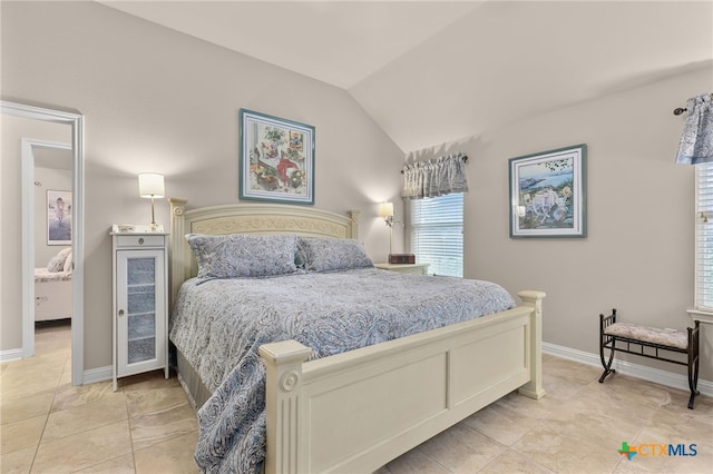 2935 Angelina Dr, Round Rock, TX 78665 - bedroom with lofted ceiling, baseboards, and light tile patterned flooring