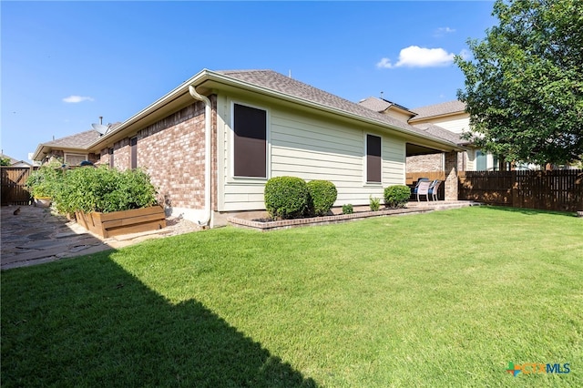 2935 Angelina Dr, Round Rock, TX 78665 - back of house featuring brick siding and a shingled roof