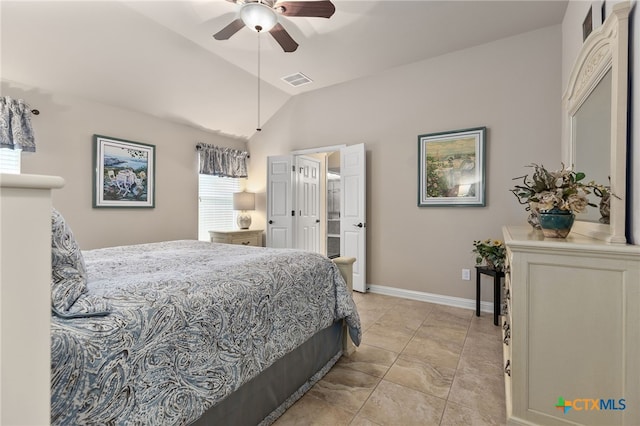 2935 Angelina Dr, Round Rock, TX 78665 - bedroom with vaulted ceiling, light tile patterned flooring, baseboards, a ceiling fan, and ensuite bathroom