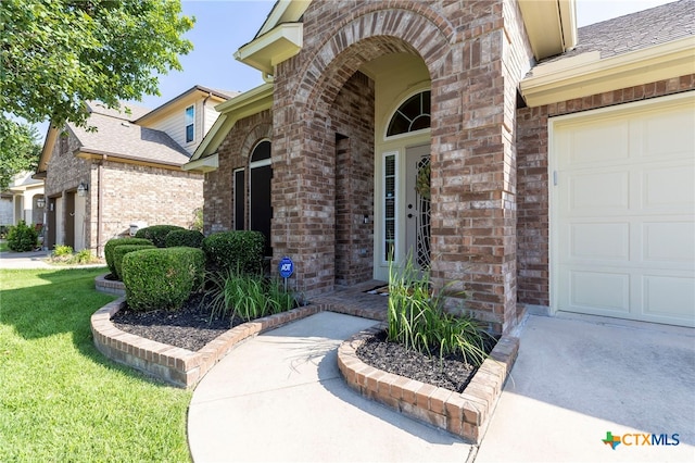 2935 Angelina Dr, Round Rock, TX 78665 - entrance to property with brick siding, a shingled roof, and a yard