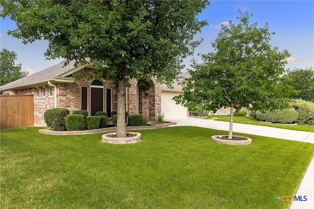 2935 Angelina Dr, Round Rock, TX 78665 - view of front of home featuring driveway, brick siding, and an attached garage