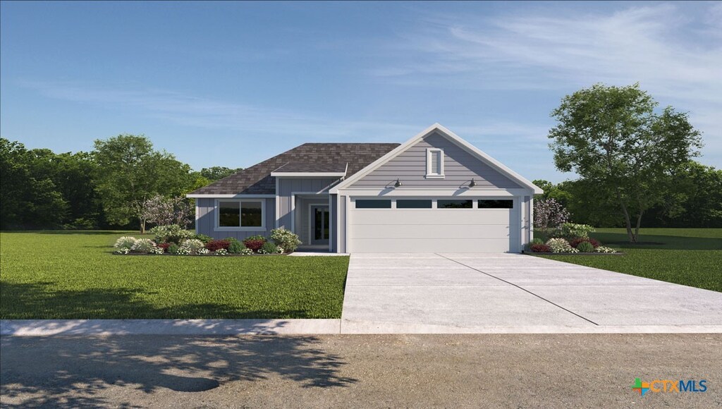 view of front of property featuring a garage, driveway, a front lawn, and roof with shingles