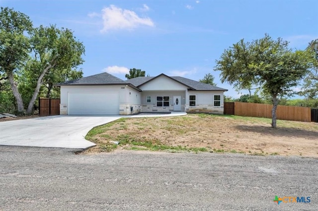 single story home featuring a garage