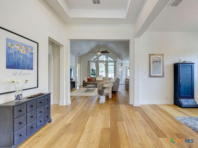 599 Mission Hill Run, New Braunfels, TX 78132 - foyer with light wood-style floors, ceiling fan, lofted ceiling, baseboards, and a tray ceiling