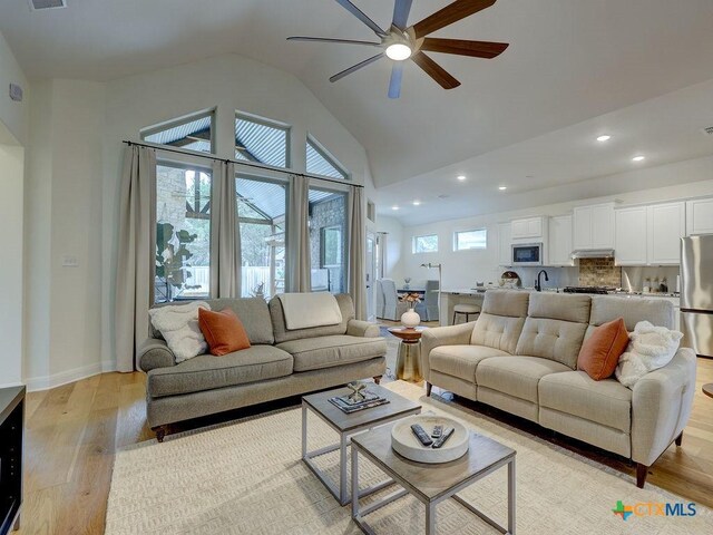 599 Mission Hill Run, New Braunfels, TX 78132 - living room with ceiling fan, light wood-type flooring, recessed lighting, and high vaulted ceiling