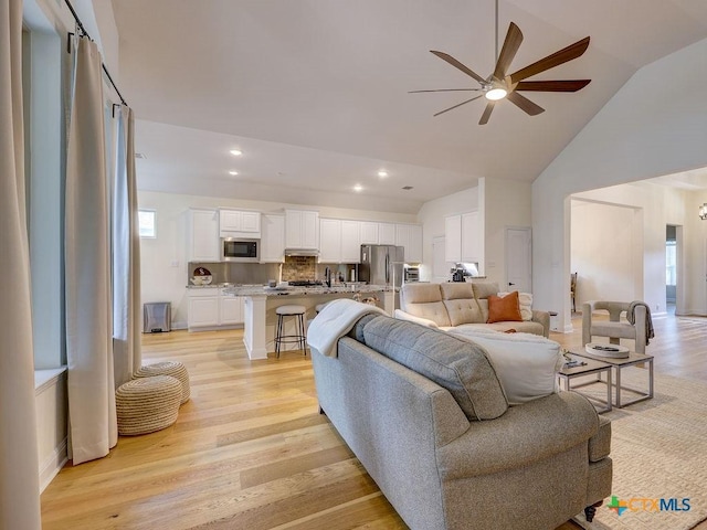 599 Mission Hill Run, New Braunfels, TX 78132 - living area with a ceiling fan, light wood-style floors, recessed lighting, and high vaulted ceiling