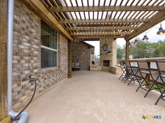599 Mission Hill Run, New Braunfels, TX 78132 - view of patio featuring an outdoor stone fireplace and a pergola