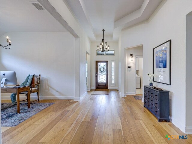 599 Mission Hill Run, New Braunfels, TX 78132 - foyer entrance featuring a chandelier, light wood-type flooring, and baseboards