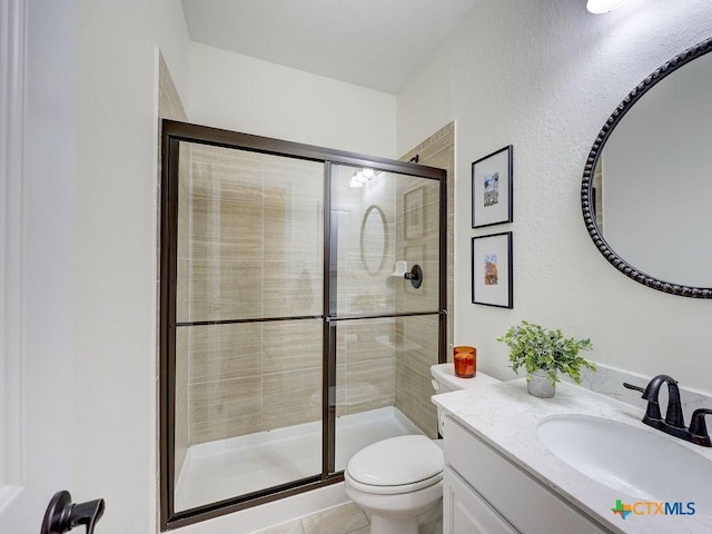 599 Mission Hill Run, New Braunfels, TX 78132 - bathroom with toilet, vanity, a stall shower, and a textured wall