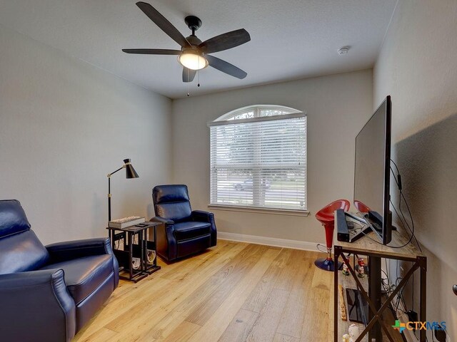599 Mission Hill Run, New Braunfels, TX 78132 - sitting room featuring wood finished floors, ceiling fan, and baseboards