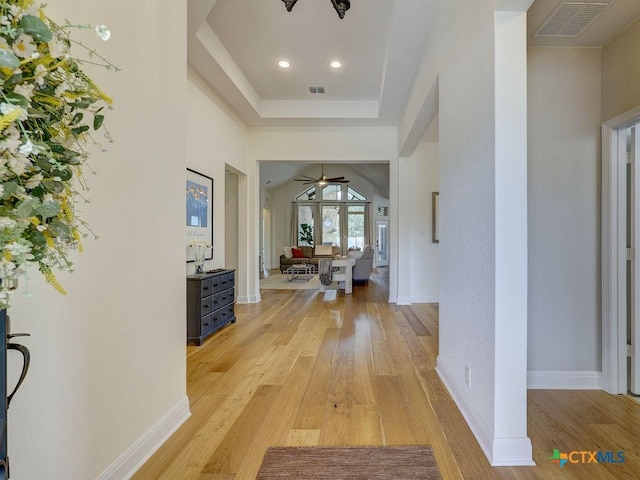 599 Mission Hill Run, New Braunfels, TX 78132 - foyer entrance featuring light wood-type flooring, ceiling fan, a tray ceiling, recessed lighting, and baseboards
