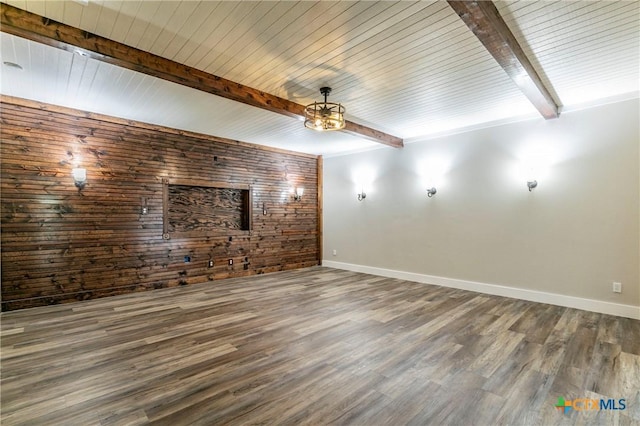 14380 Spotted Horse Ln, Salado, TX 76571 - unfurnished living room featuring wooden walls, baseboards, beamed ceiling, and wood finished floors