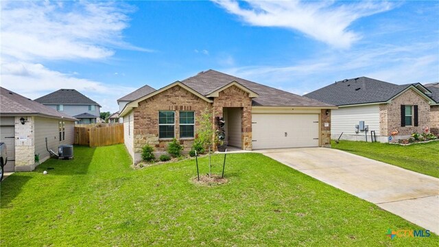 8903 Cantera Ridge Rd, Temple, TX 76502 - single story home with concrete driveway, a garage, brick siding, and roof with shingles