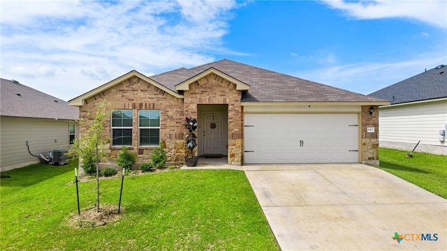 8903 Cantera Ridge Rd, Temple, TX 76502 - ranch-style home featuring a garage, a front yard, driveway, brick siding, and roof with shingles