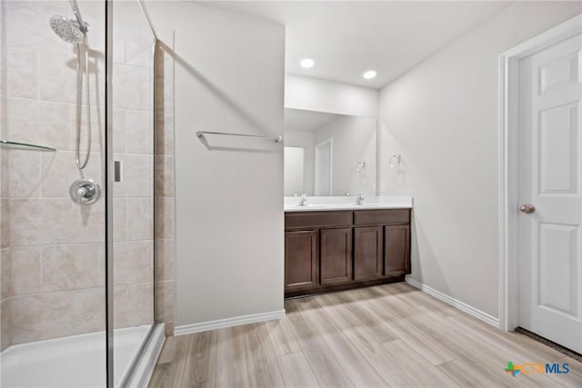 8903 Cantera Ridge Rd, Temple, TX 76502 - full bath featuring double vanity, a shower stall, wood finished floors, and recessed lighting