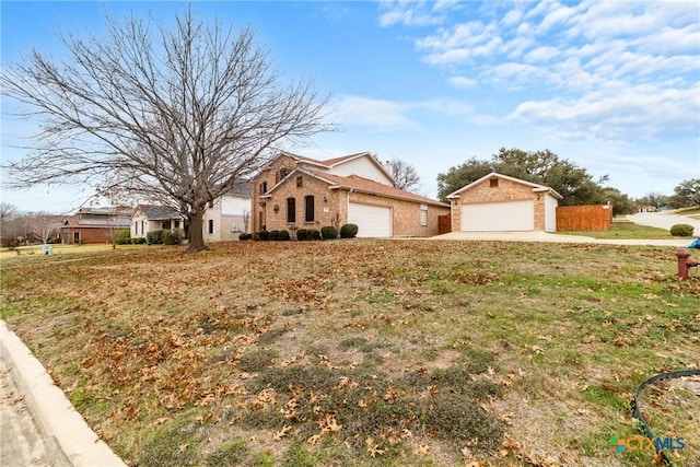 ranch-style home with a garage and a front lawn