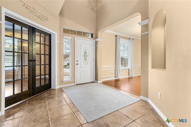 tiled entrance foyer with french doors