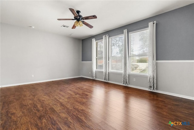 spare room featuring dark hardwood / wood-style floors, plenty of natural light, and ceiling fan