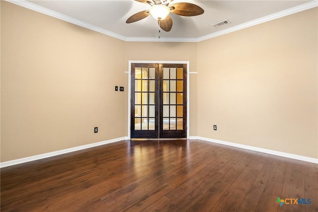 empty room featuring french doors, dark hardwood / wood-style floors, and ornamental molding