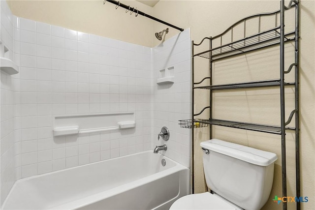 bathroom with washtub / shower combination and toilet