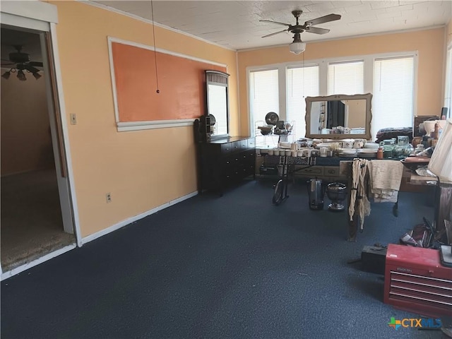 office area with ceiling fan and crown molding