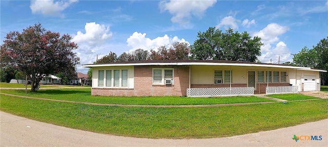 500 N Texas Ave, Nixon, TX 78140 - ranch-style home featuring a garage, a front lawn, a porch, brick siding, and cooling unit