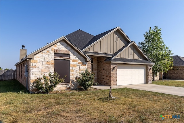 view of front of house with a garage and a front lawn