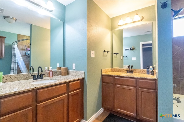 bathroom with vanity and walk in shower