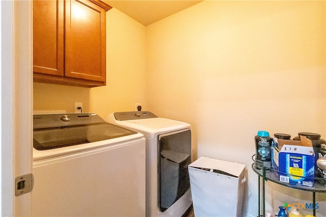 laundry area with cabinets and washing machine and dryer