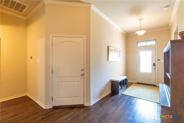 foyer featuring crown molding and dark hardwood / wood-style floors