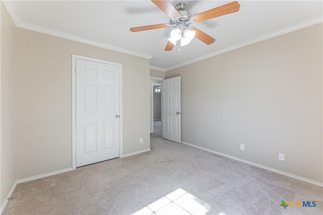 unfurnished bedroom with baseboards and carpet flooring