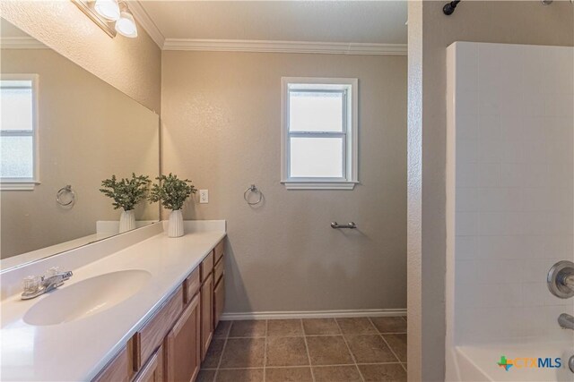 full bath featuring ornamental molding and a wealth of natural light