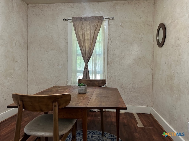 unfurnished dining area featuring hardwood / wood-style flooring