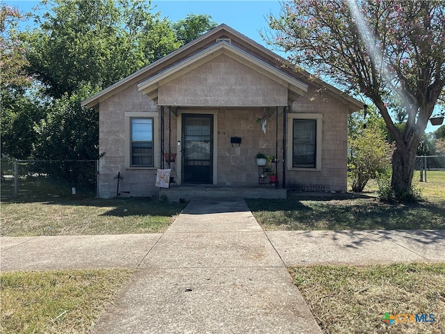 bungalow with a front lawn