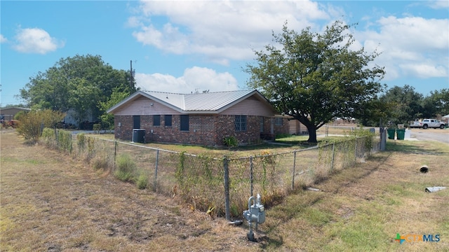 view of side of property featuring central air condition unit