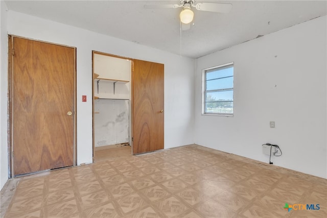 unfurnished bedroom featuring ceiling fan