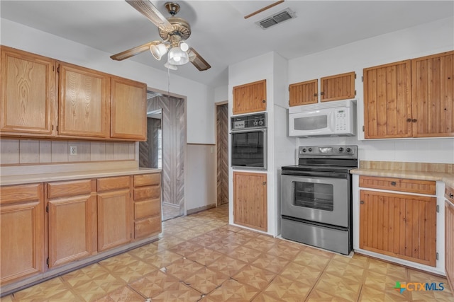 kitchen with ceiling fan, oven, and electric stove