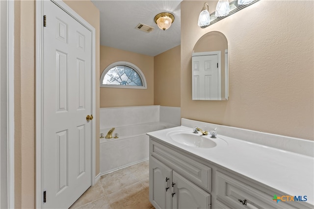 bathroom with vanity and tile patterned floors