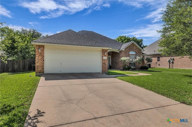 5708 High Meadow Dr, Temple, TX 76502 - view of front facade featuring brick siding, driveway, a garage, and a shingled roof