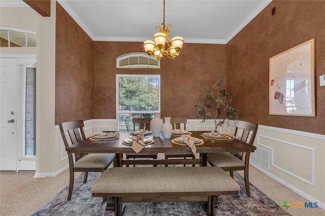 5708 High Meadow Dr, Temple, TX 76502 - dining room featuring ornamental molding, a chandelier, wainscoting, and carpet floors
