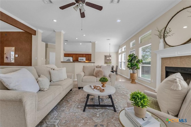 5708 High Meadow Dr, Temple, TX 76502 - living room with ceiling fan, crown molding, a tile fireplace, and recessed lighting